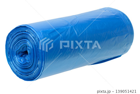 A roll of blue plastic garbage bags on an isolated background, tightly rolled 139051421