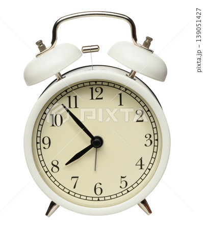 Classic white table alarm clock with two metal bells and a hammer Classic white table alarm clock with two metal bells and a hammer 139051427