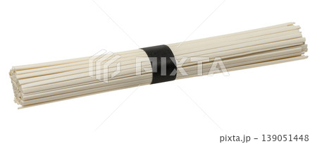 A bunch of dry white rice noodles tied tightly with a black paper ribbon in the middle A bunch of dry white rice noodles tied tightly with a black paper ribbon in the middle 139051448