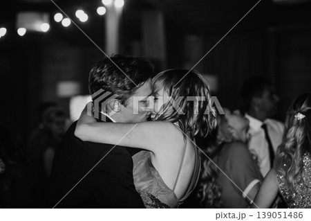 Couple kissing romantic intimacy embrace wedding celebration Couple kissing romantic intimacy embrace wedding celebration 139051486