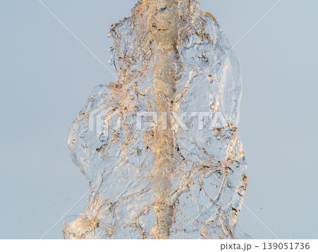 Splashes and jets of water against light background. 139051736