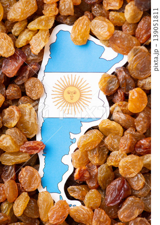Flag and map of Argentina in raisins. Agribusiness in Argentina, leader of raisins produced 139051811