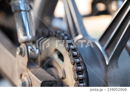 Motorcycle drive chain on a wheel, close up. Concepts of vehicle, transport and machinery 139052008