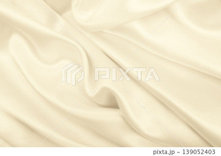 Smooth elegant golden silk or satin luxury cloth texture as wedding background. Luxurious background design. In Sepia toned. Retro style Smooth elegant golden silk or satin luxury cloth texture as wedding background. Luxurious background design. In Sepia toned. Retro style 139052403