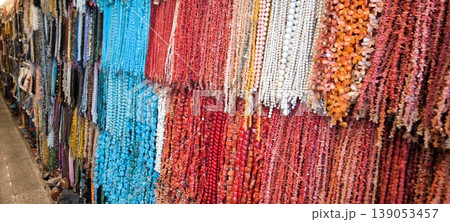A bright variety of beads and jewelry made from natural stones 139053457