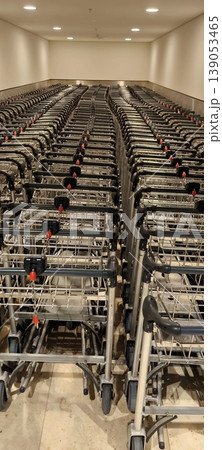 Long rows of folded luggage carts at airports and supermarkets Long rows of folded luggage carts at airports and supermarkets 139053465