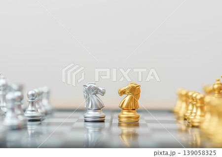 gold Chess knight figure and Checkmate opponent during chessboard competition. Strategy, Success, management, business planning, win, disruption, Trade war and leadership concept 139058325