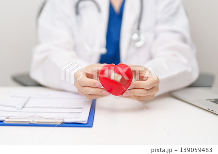 Doctor hand holding red heart shape in hospital. love, donor, world heart day, world health day, CSR donation and Insurance concepts 139059483