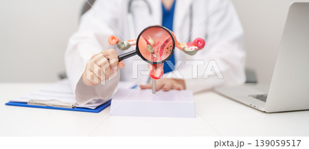 Doctor with Uterus and Ovaries anatomy model. Ovarian and Cervical cancer, Cervix disorder, Endometriosis, Hysterectomy, Uterine fibroids, Reproductive system, Pregnancy and health concept Doctor with Uterus and Ovaries anatomy model. Ovarian and Cervical cancer, Cervix disorder, Endometriosis, Hysterectomy, Uterine fibroids, Reproductive system, Pregnancy and health concept 139059517