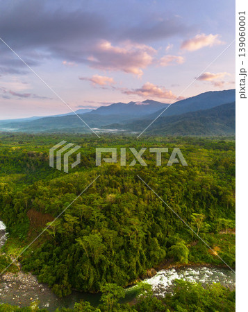 Beautiful morning view in Indonesia, panoramic landscape of rice fields with mountain ranges and clear sky Beautiful morning view in Indonesia, panoramic landscape of rice fields with mountain ranges and clear sky 139060001