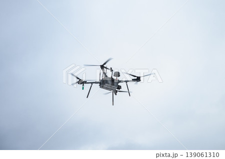 Military bomber drone flying in cloudy sky Military bomber drone flying in cloudy sky 139061310