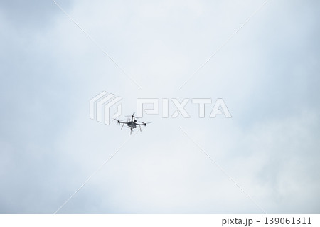Military bomber drone flying in cloudy sky Military bomber drone flying in cloudy sky 139061311