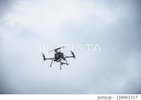 Armed bomber drone carrying payload in flight Armed bomber drone carrying payload in flight 139061337