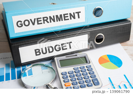 Government, BUDGET. Binder data finance report business with graph analysis in office. Government, BUDGET. Binder data finance report business with graph analysis in office. 139061790