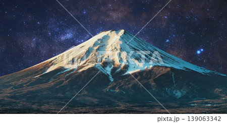 a beautiful night shot of a mountain in the night starry sky 139063342