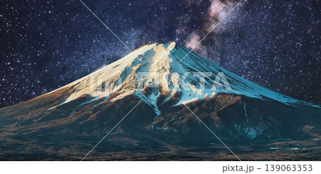 a beautiful night shot of a mountain in the night starry sky 139063353