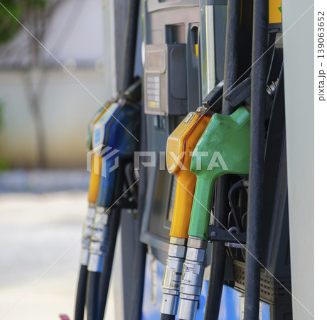 Petrol pump filling nozzles, Gas station in a service Petrol pump filling nozzles, Gas station in a service 139063652