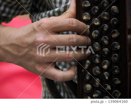 hands playing alpine bavarian accordion 139064160