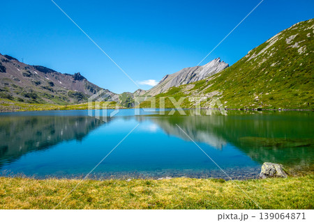 Alpine Jovet lakes with clear reflection in Les Contamines-Montjoie, France Alpine Jovet lakes with clear reflection in Les Contamines-Montjoie, France 139064871