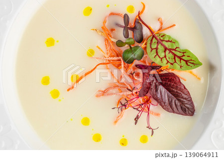 Vegan cream soup with microgreens and olive oil fine dining minimal plating Vegan cream soup with microgreens and olive oil fine dining minimal plating 139064911