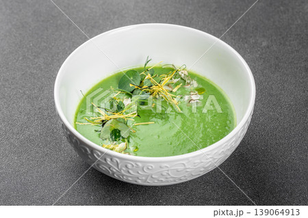 Green detox cream soup with microgreens healthy vegan puree minimal food styling 139064913