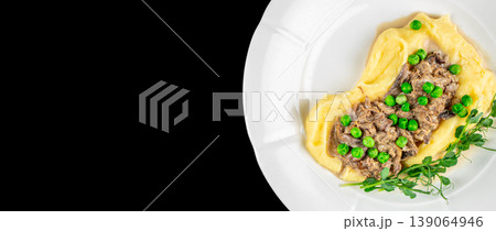 mashed potatoes meat sauce peas plate top view with copy space black background mashed potatoes meat sauce peas plate top view with copy space black background 139064946