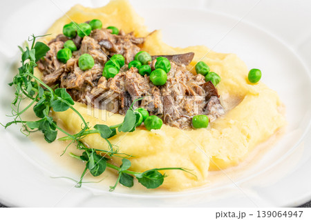 mashed potatoes meat stew peas plate close up food photography 139064947