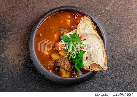 Meat stew with potatoes in bowl top view Meat stew with potatoes in bowl top view 139064954