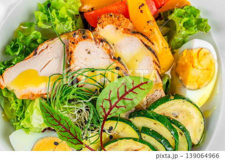 Chicken salad with vegetables and egg healthy protein meal close up texture Chicken salad with vegetables and egg healthy protein meal close up texture 139064966