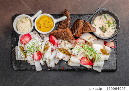 Meat slices with bread mustard and sauce appetizer top view Meat slices with bread mustard and sauce appetizer top view 139064995