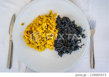 Traditional Paella and Black Squid Ink Rice in Valencia Spain 139065073