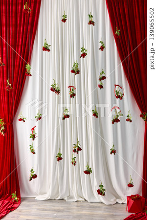 Creative Photo Zone with Hanging Red Roses Creative Photo Zone with Hanging Red Roses 139065502