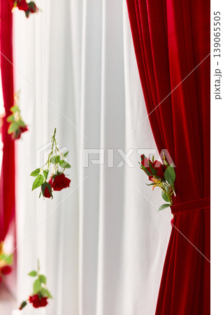 Romantic Detail of Hanging Red Roses Backdrop Romantic Detail of Hanging Red Roses Backdrop 139065505
