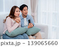 Young asian couple sitting on sofa in living room at home. 139065660