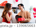 Happy asian man giving heart gift box to girlfriend celebrating Valentine's Day or anniversary. 139065663