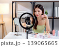 Young asian woman presenting and review cosmetic product with excitement on social media. 139065665