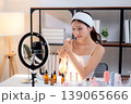 Young asian woman presenting and review cosmetic product with on social media. 139065666