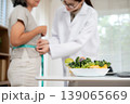 Nutritionist examining senior woman for weightloss planning for health in clinic office. 139065669