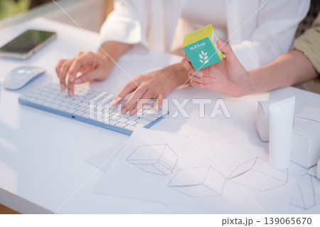 Hand holding cosmetic packaging mockup box, graphic designer and development branding project. 139065670