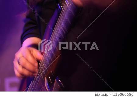 Guitar playing on stage live concert instrument detail Guitar playing on stage live concert instrument detail 139066586