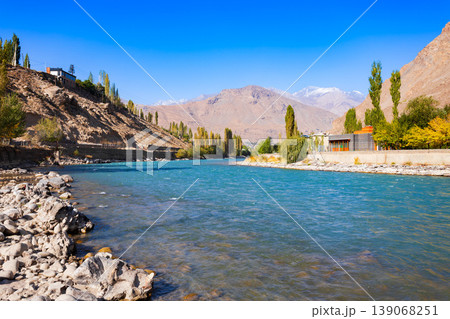 Ghunt river in Khorog city and Pamir mountains, Tajikistan Ghunt river in Khorog city and Pamir mountains, Tajikistan 139068251