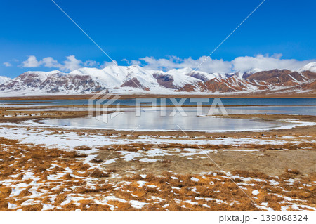 Shorkul lake and Pamir mountains near Murghab town, Tajikistan 139068324