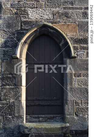 Medieval style doorway in stone building Medieval style doorway in stone building 139069442