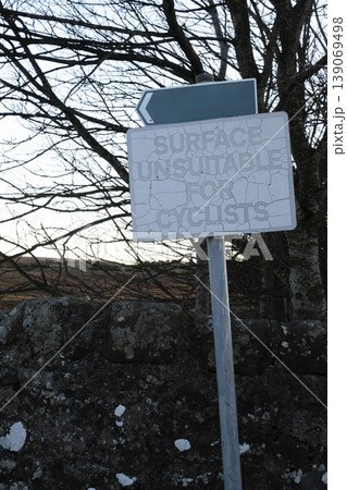 Aged warning sign for cyclists with peeling paint Aged warning sign for cyclists with peeling paint 139069498