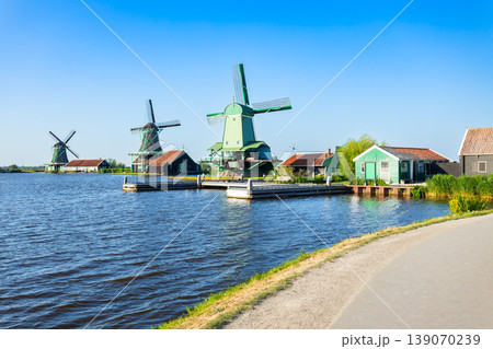 Windmills and traditional houses in Zaanse Schans, Netherlands 139070239