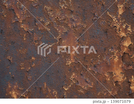 Detailed view of a heavily corroded metal surface featuring peeling layers of rich brown and dark orange rust Detailed view of a heavily corroded metal surface featuring peeling layers of rich brown and dark orange rust 139071079