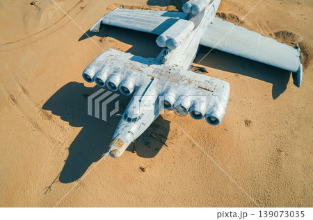 Abandoned Lun-class ekranoplan on a deserted beach near the Caspian Sea under a clear blue sky Abandoned Lun-class ekranoplan on a deserted beach near the Caspian Sea under a clear blue sky 139073035