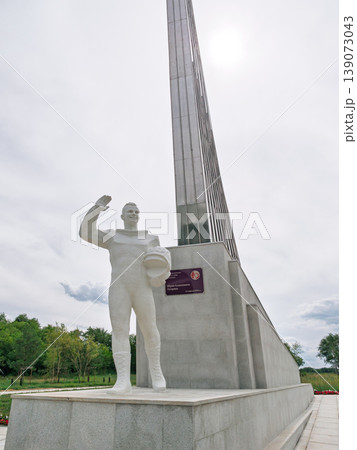 Cosmonaut Yuri Gagarin statue honoring space exploration with a sleek monument under a cloudy sky Cosmonaut Yuri Gagarin statue honoring space exploration with a sleek monument under a cloudy sky 139073043