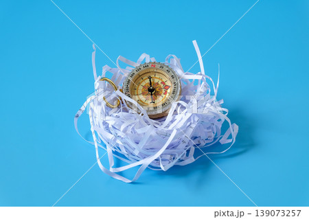 Vintage Compass in shredded paper. Vintage Compass in shredded paper. 139073257