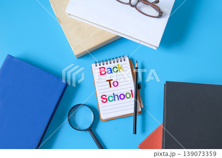 A book note with pen and hard cover books,Back to school concept. A book note with pen and hard cover books,Back to school concept. 139073359